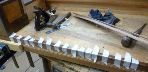 Square Piano taped for glueing woodwork